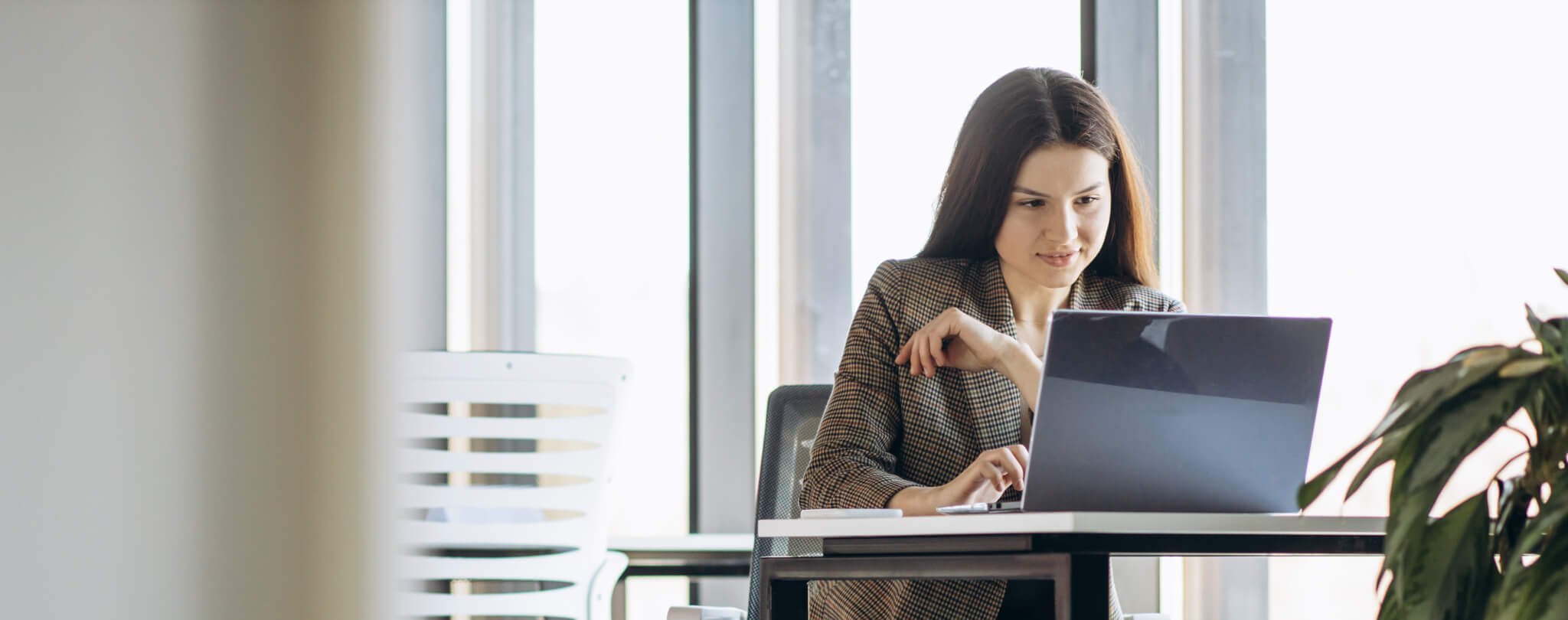 Contractor looking at accounting software on laptop