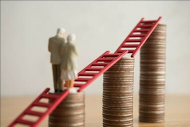 Director reviewing pension contribution options and allowable business expenses to reduce taxable profits and Corporation Tax.