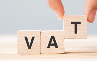 Business owner reviewing VAT scheme options — Standard VAT, Cash Accounting, Flat Rate Scheme and Annual Accounting — to improve cash flow and tax efficiency.