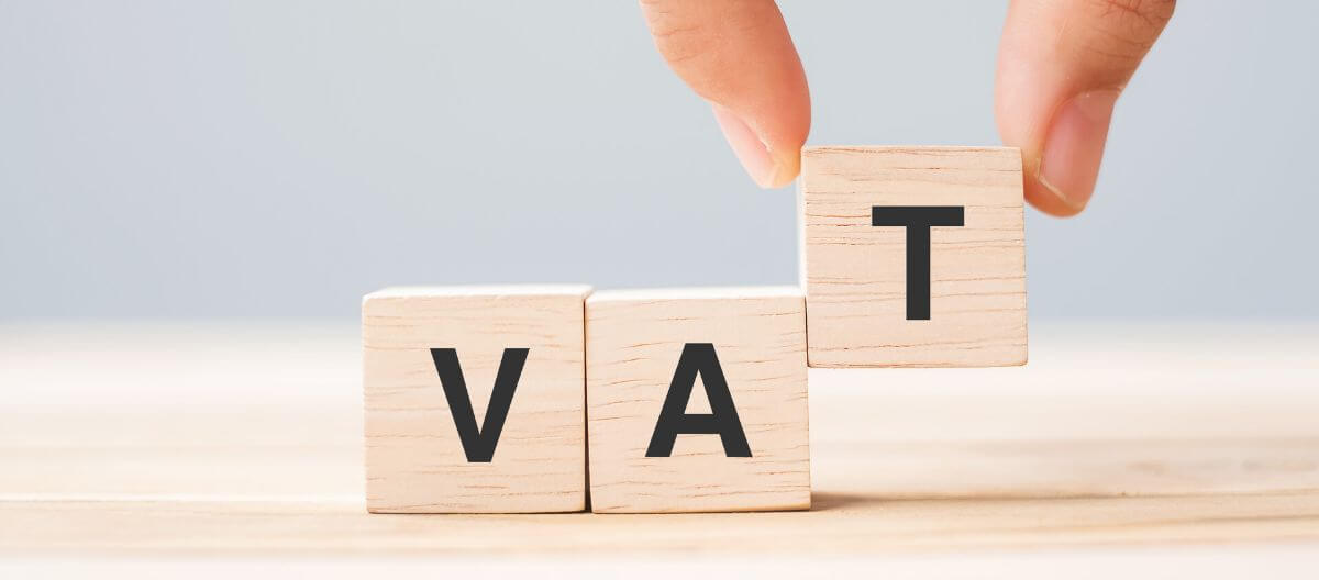 Business owner reviewing VAT scheme options — Standard VAT, Cash Accounting, Flat Rate Scheme and Annual Accounting — to improve cash flow and tax efficiency.