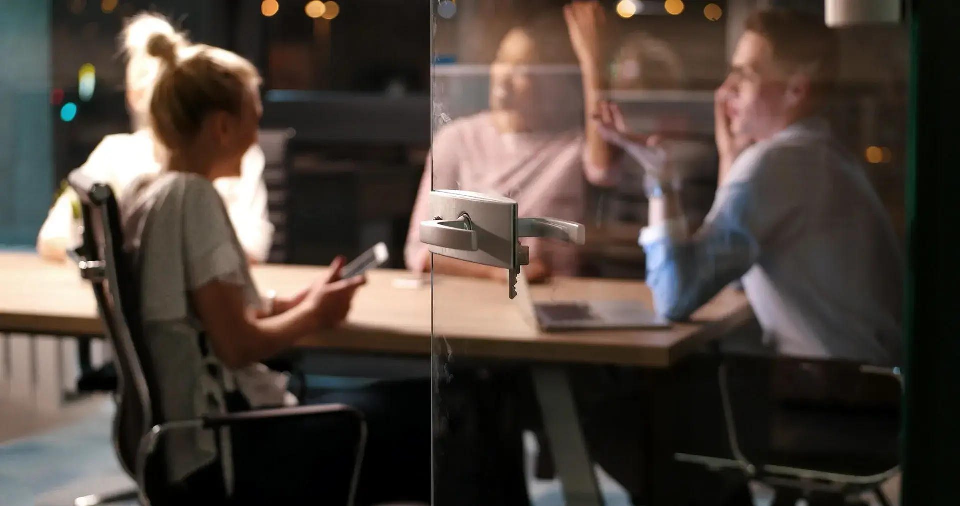 Team meeting in a glass meeting room